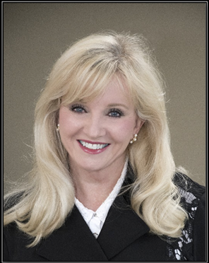 Smiling woman with long blonde hair.